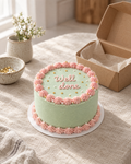 Well Done Bento: a 4 inch bento cake in smooth mint buttercream with a pink shell border and tiny gold sugar stars on the top