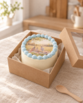 Small white bento cake with a blue shell border and an edible printed photo on top