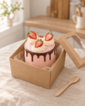 Small pink bento cake with a chocolate drip, rosettes and strawberries