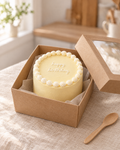 Small yellow bento cake with a white shell border and happy birthday piped on top