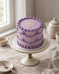 Star Sign Lambeth Cake: smooth lilac buttercream with violet shells and swags, tiny piped gold stars dotted over the sides, and a small piped scorpion symbol in gold under the message on the top