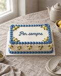 Amalfi Lemon Sheet Cake: a rectangular two-layer sheet cake in white buttercream framed with Mediterranean blue shells and scroll corners, small piped yellow lemons with green leaves in each corner and along the sides