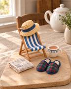 Retirement Deckchair Cake Topper Set laid out on a wooden board
