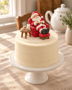 Sleeping Santa Cake Topper on top of a cake