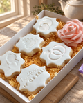 5 Vanilla Celebration Cookies Gift Box laid out on a wooden board