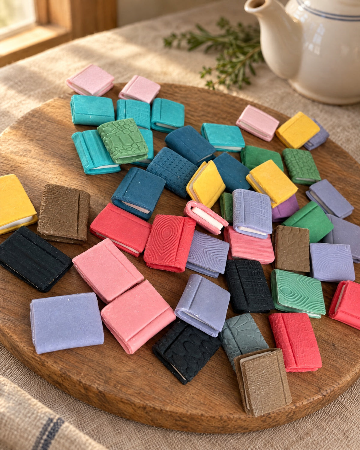 10 Book Cake and Cupcake Toppers on a linen tablecloth