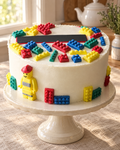48 Building Brick Cake and Cupcake Toppers on a cream cake stand