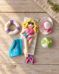 Sunbather Beach Cake Topper Set laid flat on a wooden board