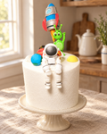 Spaceman, Rocket and Planets Cake Topper Set on a cream cake stand