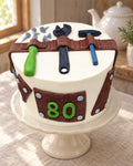 Builder's Tool Belt Cake Topper Set on a linen tablecloth