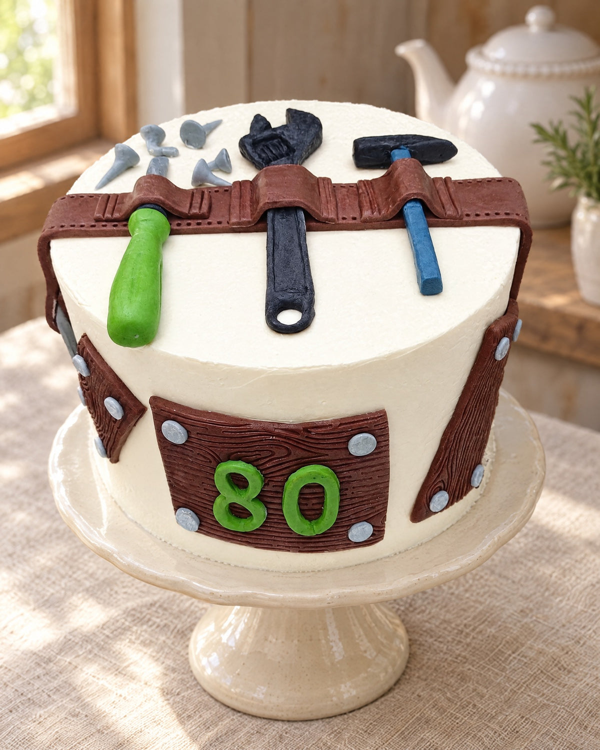Builder's Tool Belt Cake Topper Set on a linen tablecloth
