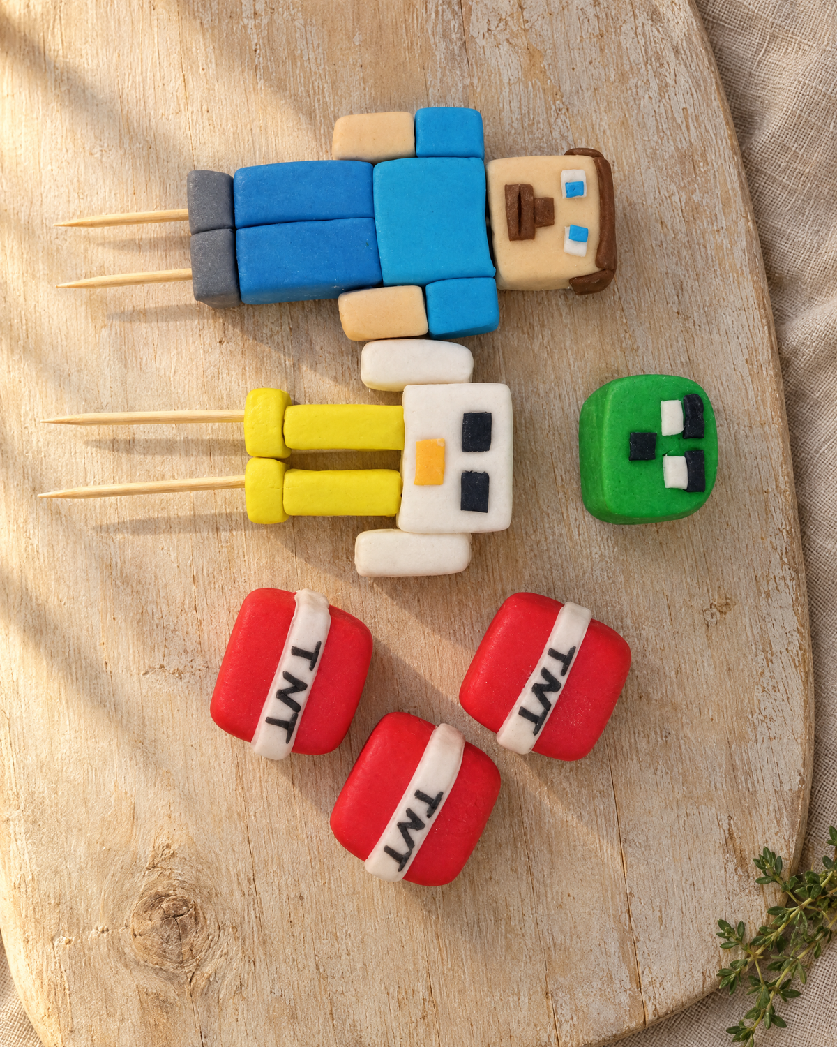 Minecraft Cake Topper Set laid flat on a wooden board