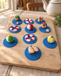 10 Pool Party Cupcake Toppers laid out on a wooden board