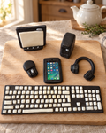 Computer, Keyboard and Phone Cake Topper Set laid out on a wooden board