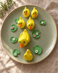Duck Family Cake Topper Set on a linen tablecloth