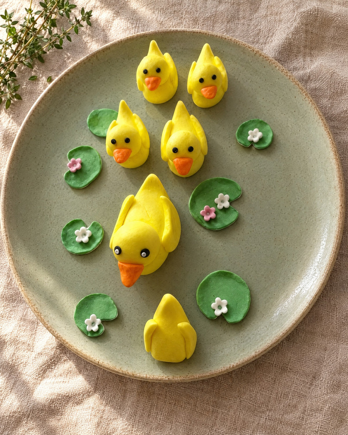 Duck Family Cake Topper Set on a linen tablecloth