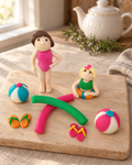 Swimming Pool Cake Topper, Girl or Boy laid out on a wooden board
