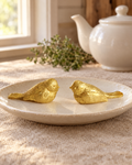 2 Gold Birds Wedding Cake Topper on a cream plate