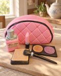 Make-Up Bag Cake Topper Set laid out on a wooden board
