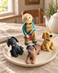 Gardener and Dogs Cake Topper on a cream plate