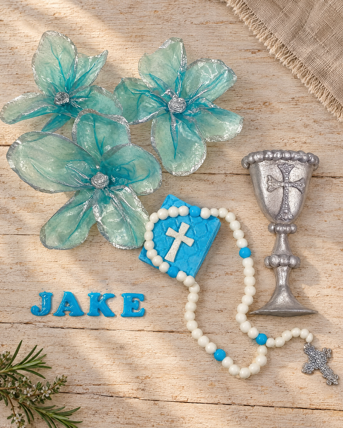 Christening and Communion Cake Topper Set laid flat on a wooden board