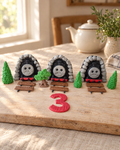 Thomas the Train Cake Topper Set laid out on a wooden board