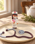 Nurse and Stethoscope Cake Topper on a linen tablecloth
