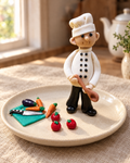 Chef Figure Cake Topper Set on a cream plate