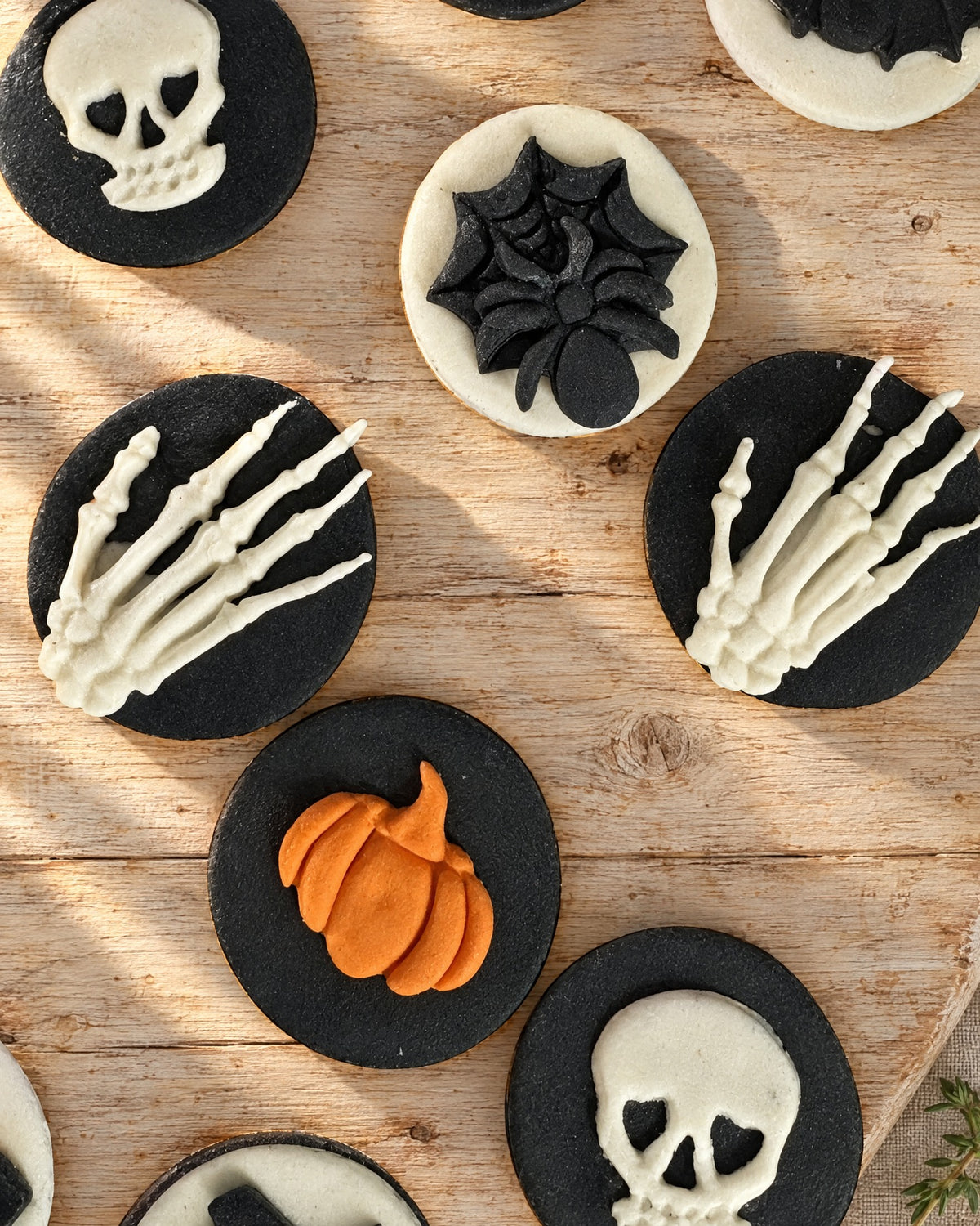 12 Halloween Cupcake Toppers on a linen tablecloth