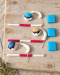 Swimming Race Cake Topper Set laid flat on a wooden board