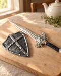 Sword and Shield Cake Topper laid out on a wooden board