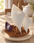 Large Pirate Ship Cake Topper on a cream plate
