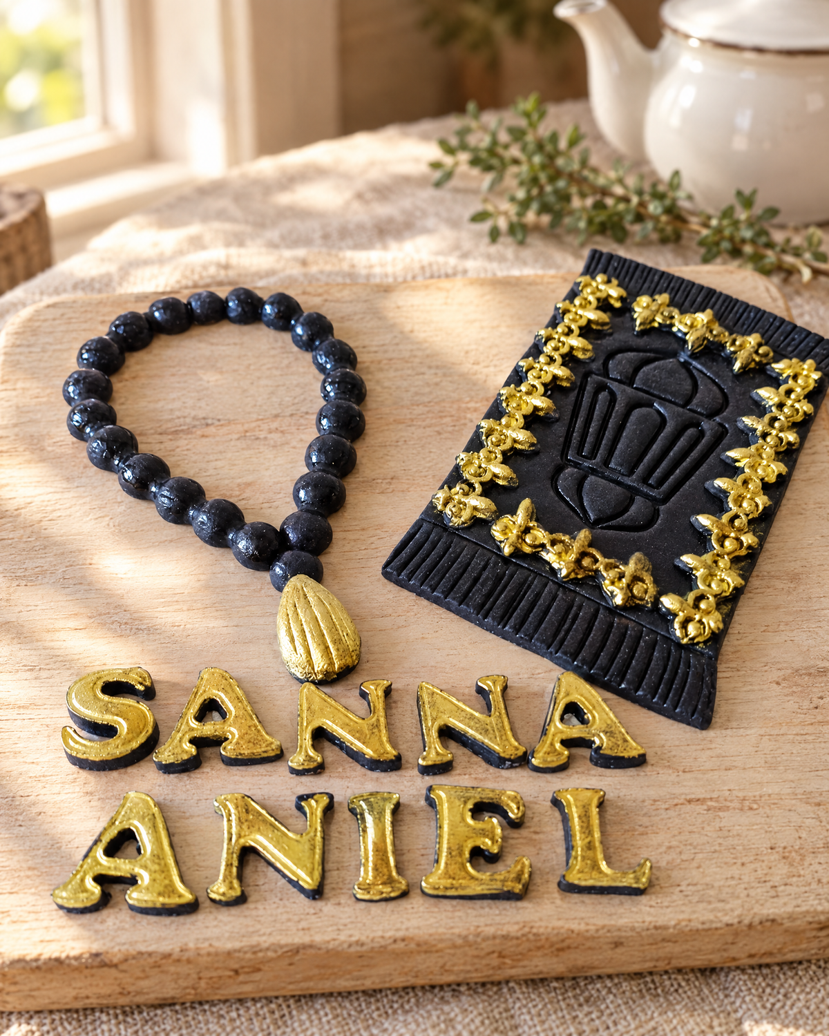 Prayer Beads and Mat Personalised Cake Topper laid out on a wooden board